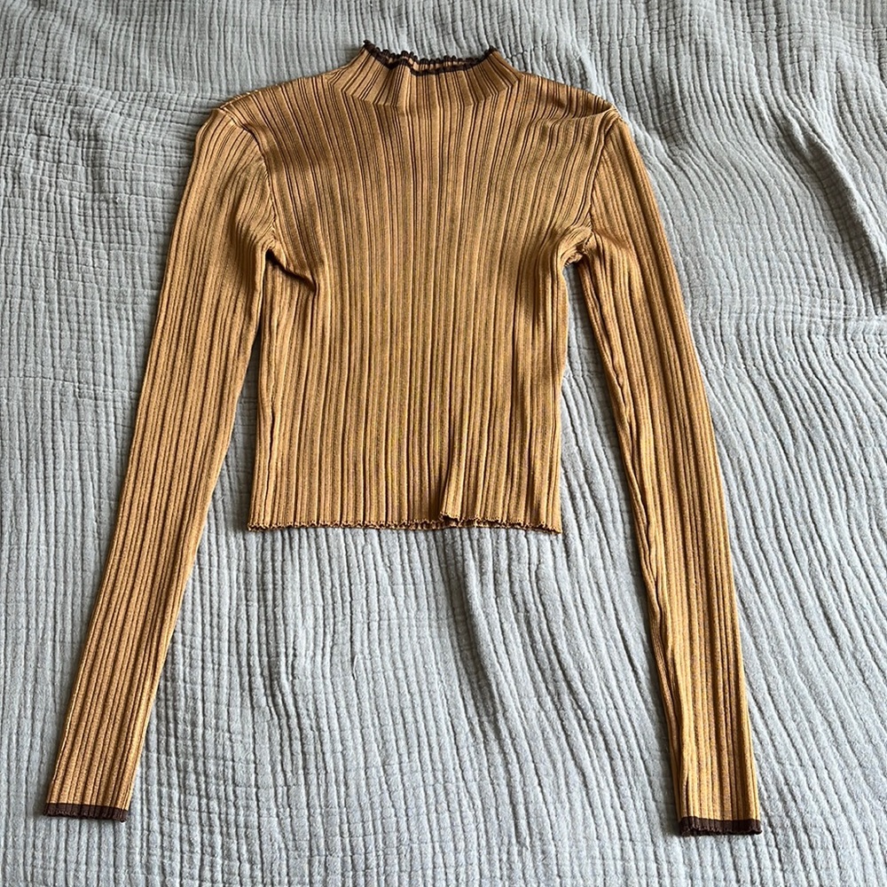 Tight gold turtleneck